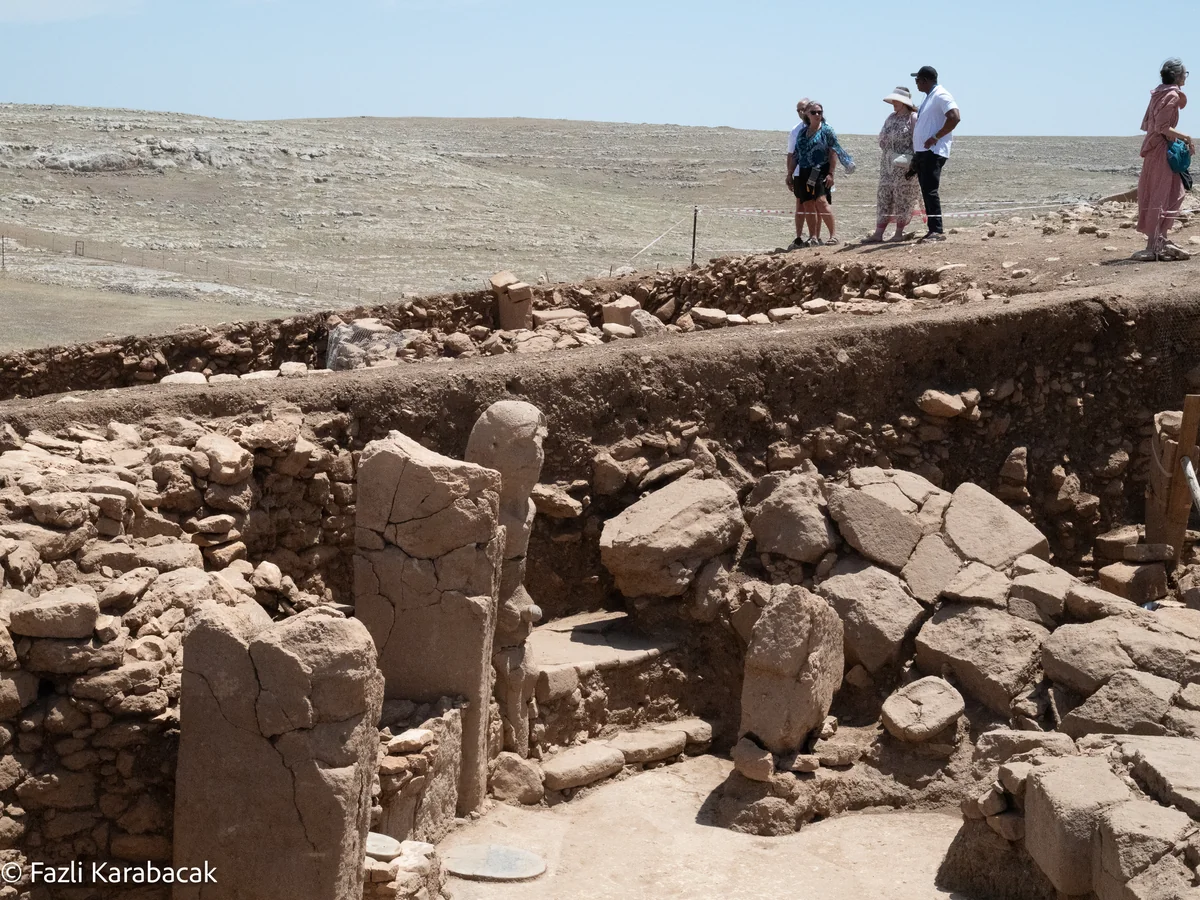 Side profile view of carved limestone head from Karahantepe Neolithic site