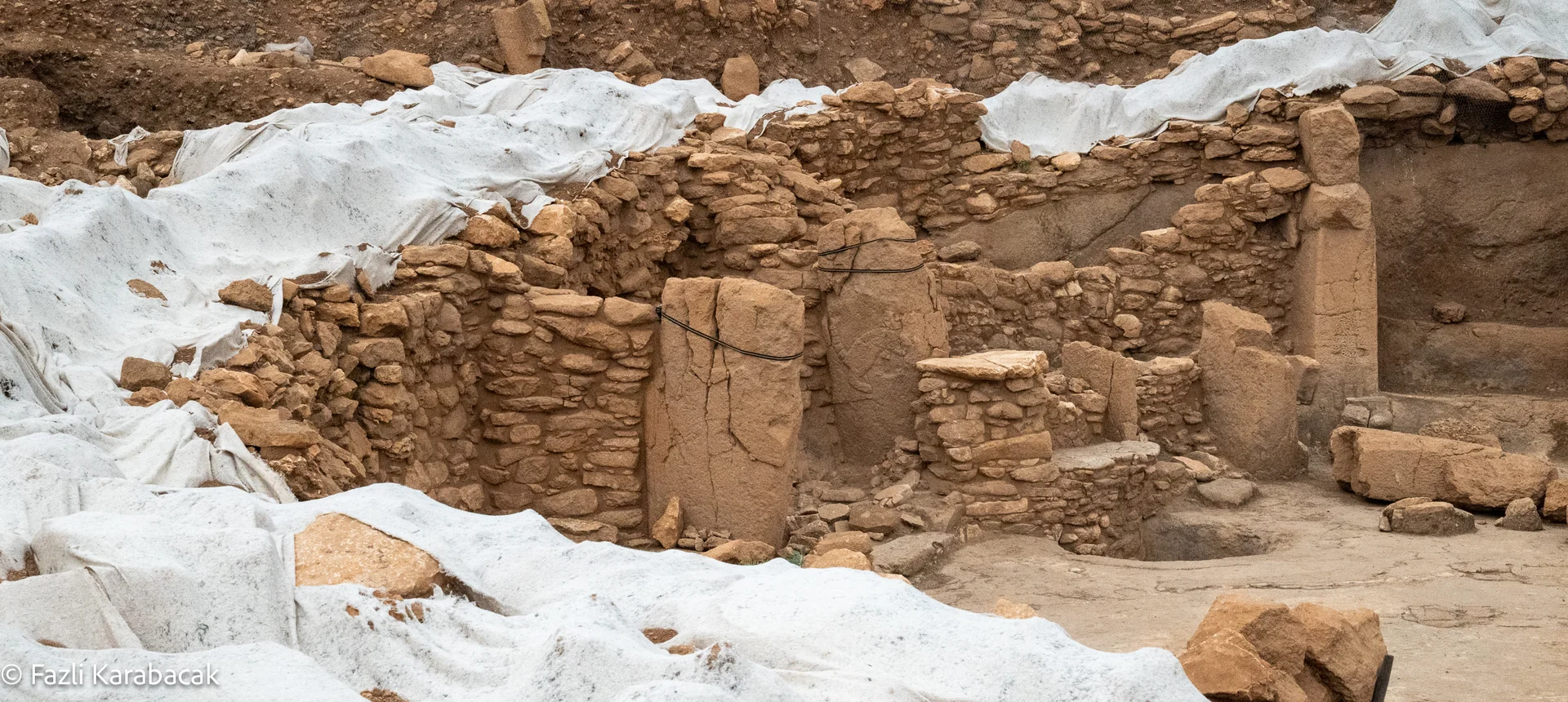 Wide panoramic photograph of the Karahantepe pillar shrine excavation site